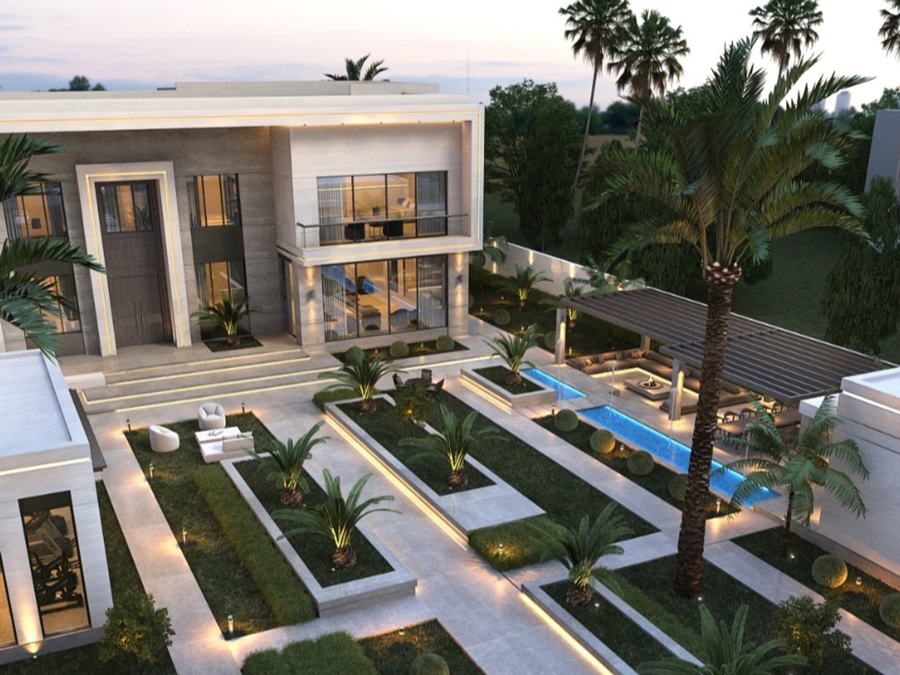 Villa exterior at twilight with lit planting beds, palms and a narrow reflecting pool